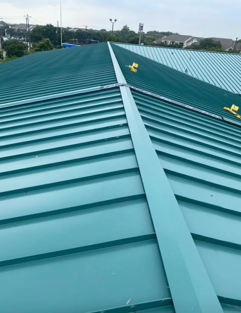 Green commercial metal roof ridge and valley for Metal Roof Repair in Fair Lakes